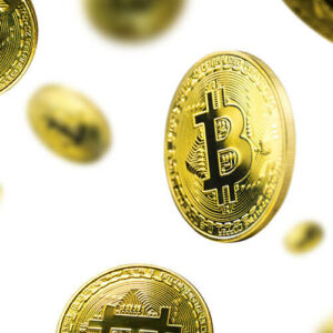 Bitcoins falling on white background