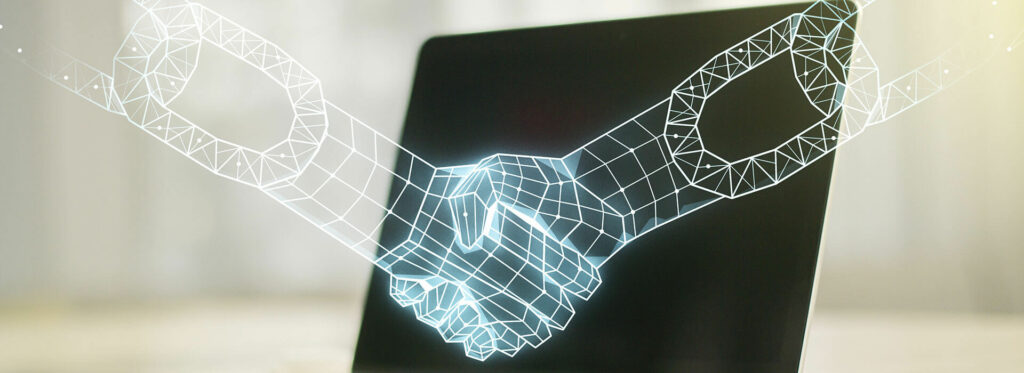Lines forming a handshake with open laptop on background on table