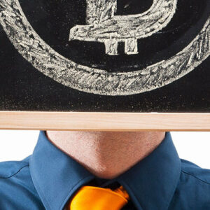 Man in suit face covered with drawn bitcoin icon