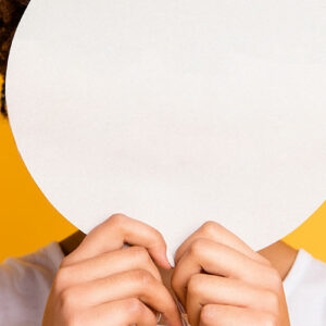 Woman with face hidden by white circle