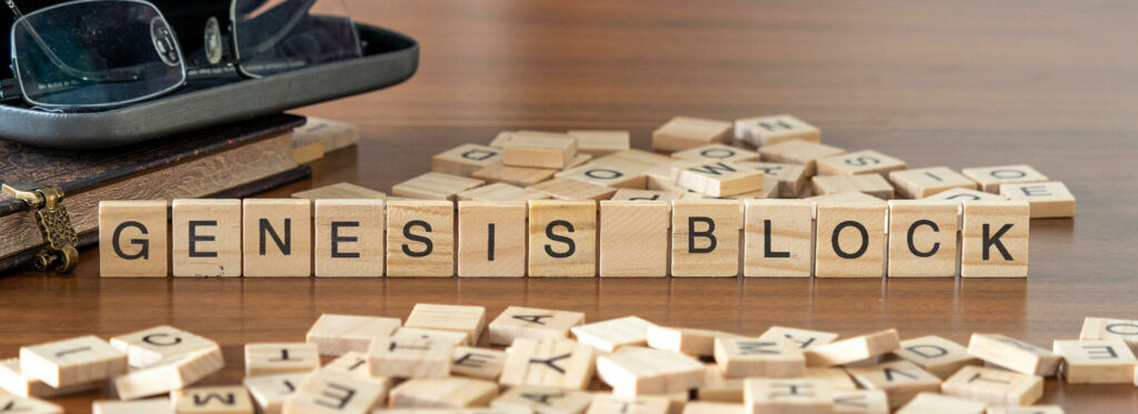 Genesis block spelled out in wooden letters on brown table