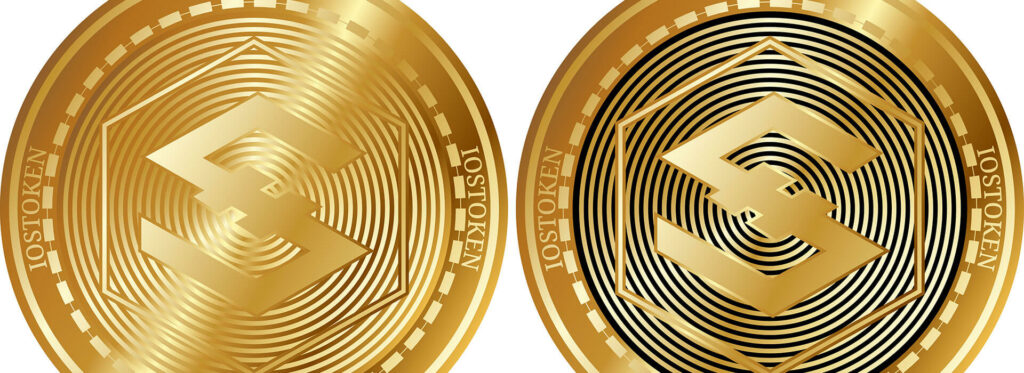 Two gold IOST crypto coins on white background